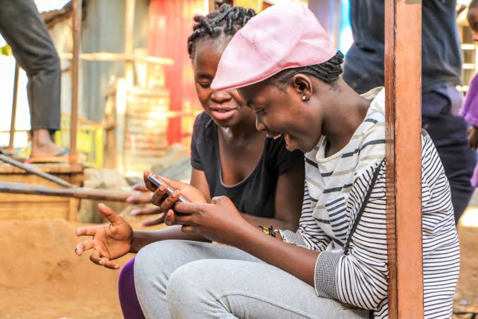 Friends connecting on mobile phones
